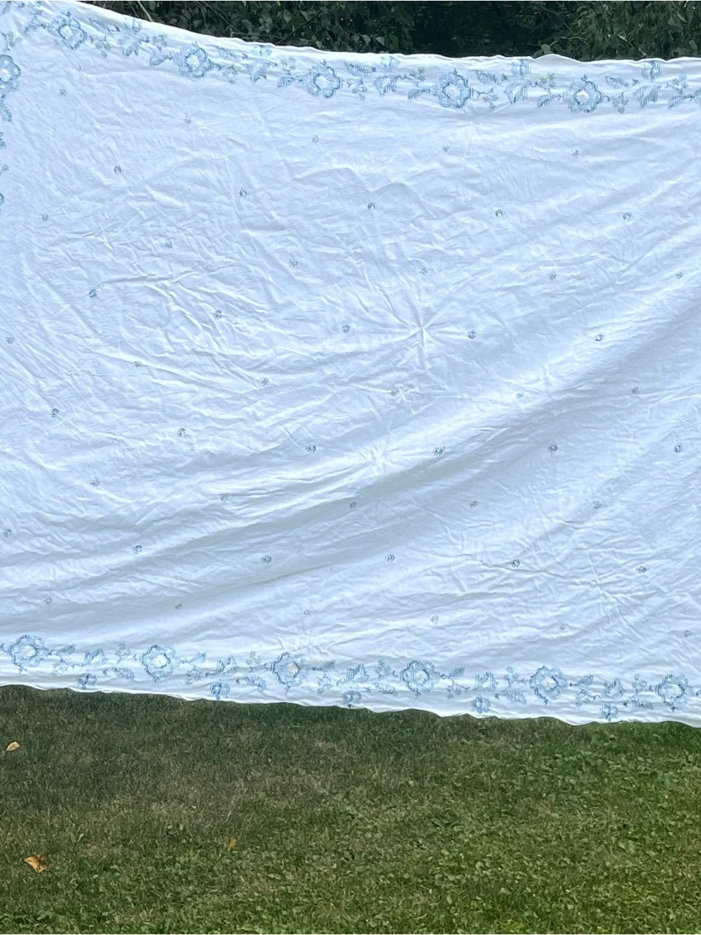 Embroidered White Linen tablecloth with blue flowers Motif